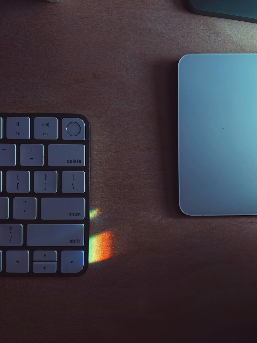 Overhead view of a laptop screen showing colorful programming code